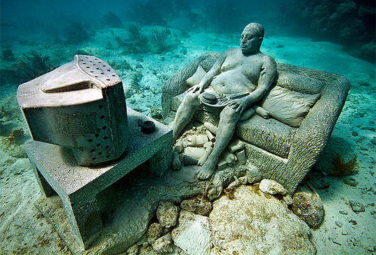 Just a local chilling in front of his TV in the Cancun Underwater Museum