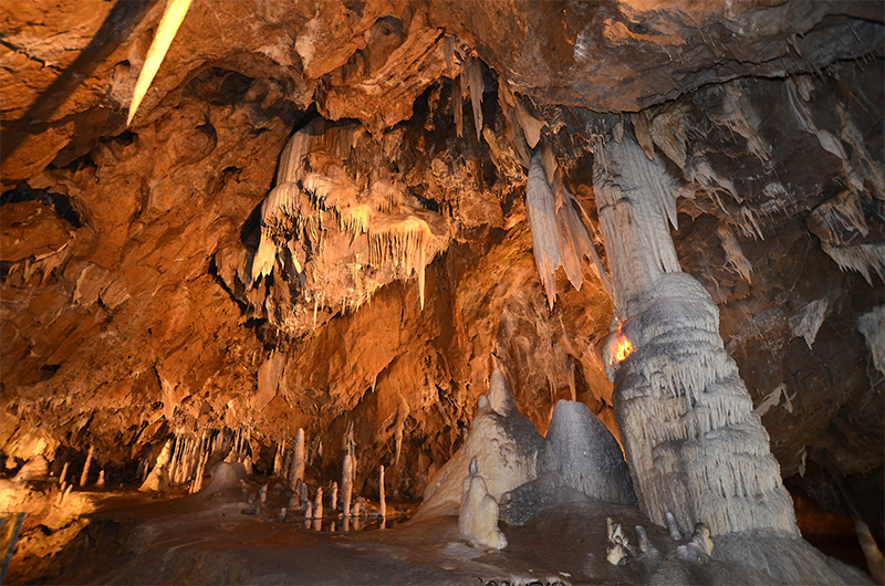 Explore the Punkevni Jeskyne caves and admire the dripstone formations covering the ceilings of the cave.