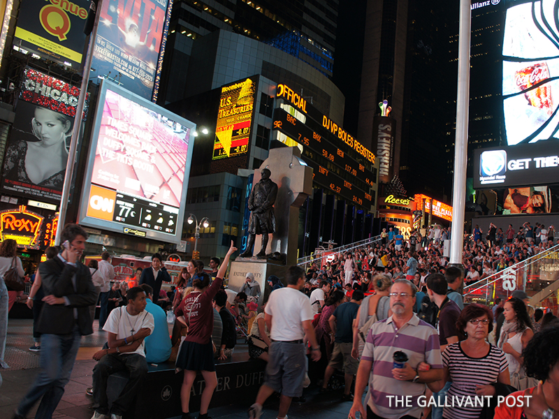 Crowded Times Square at night