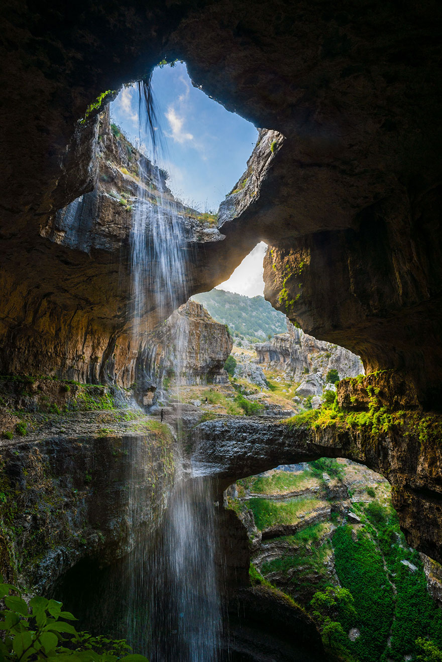 The Baatara Goge Waterfall gushes behind 3 natural bridges.